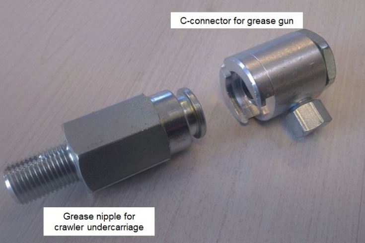 Nipple and grease adapter for tensioning crawler tracks